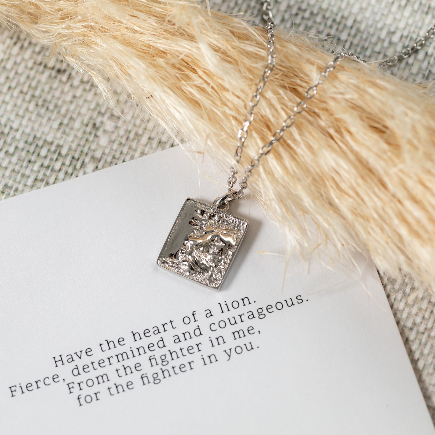 silver heart of lion necklace with square pendant
