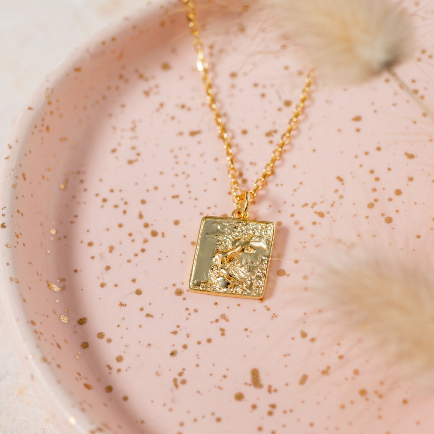 gold heart of lion necklace with square pendant