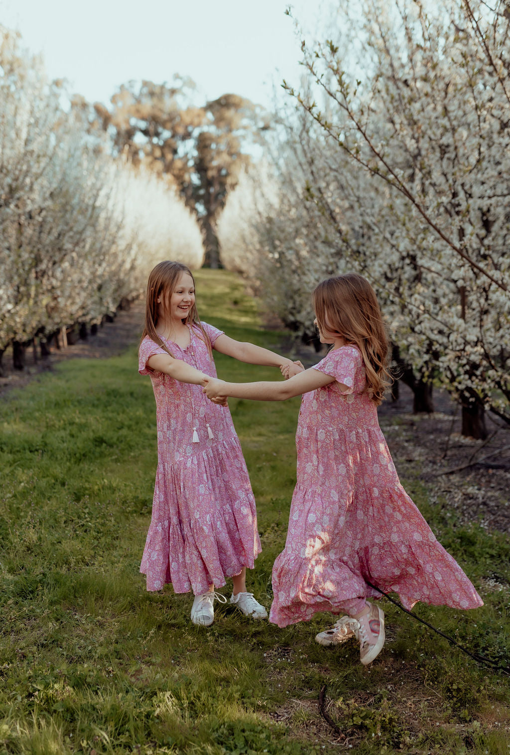 models in Sandi midi pink loose-fitting boho dress for little girls