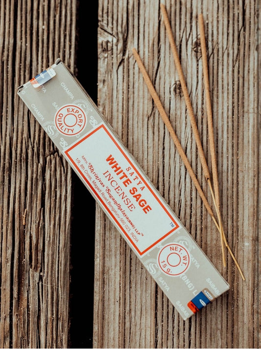 box of white sage incense in wood background