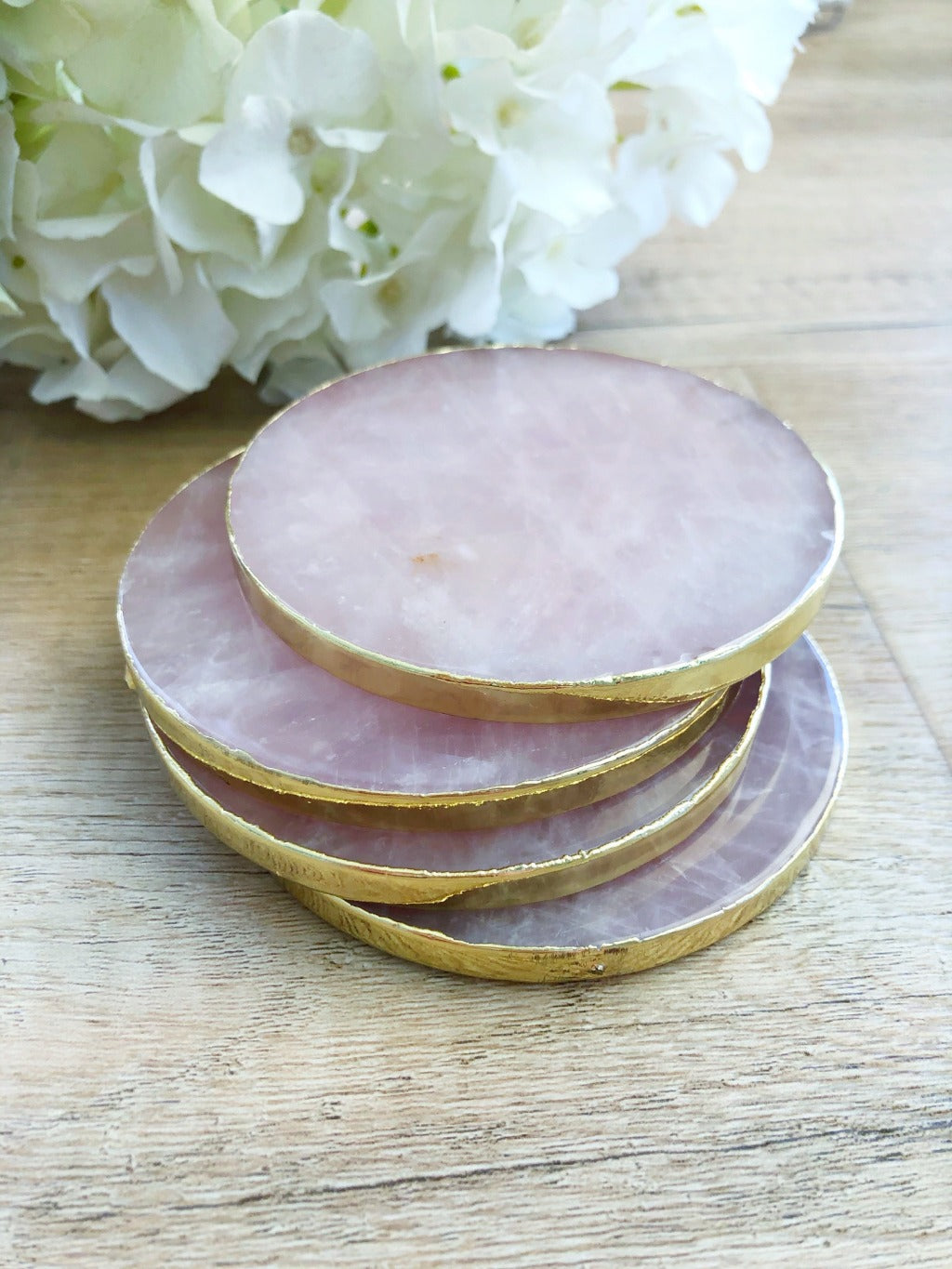 rose quartz with luxe gold trim in wood with flowers