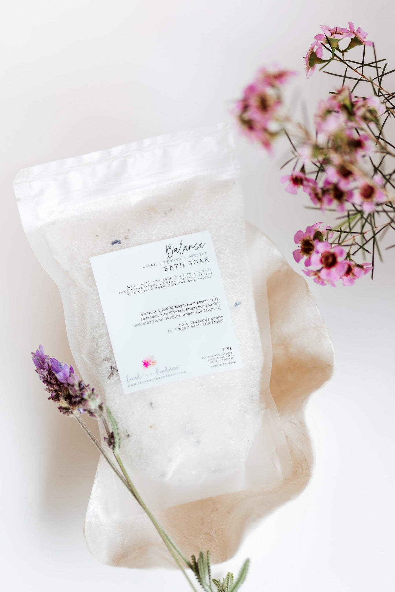 Balance Bath salts and soak containing magnesium, epsom salts, lavender, rice flowers, jasmine, woods and patchouli to enjoy a relaxing and soothing bath. Australian owned and made Laced with Kindness Homewares Luxury bath salts