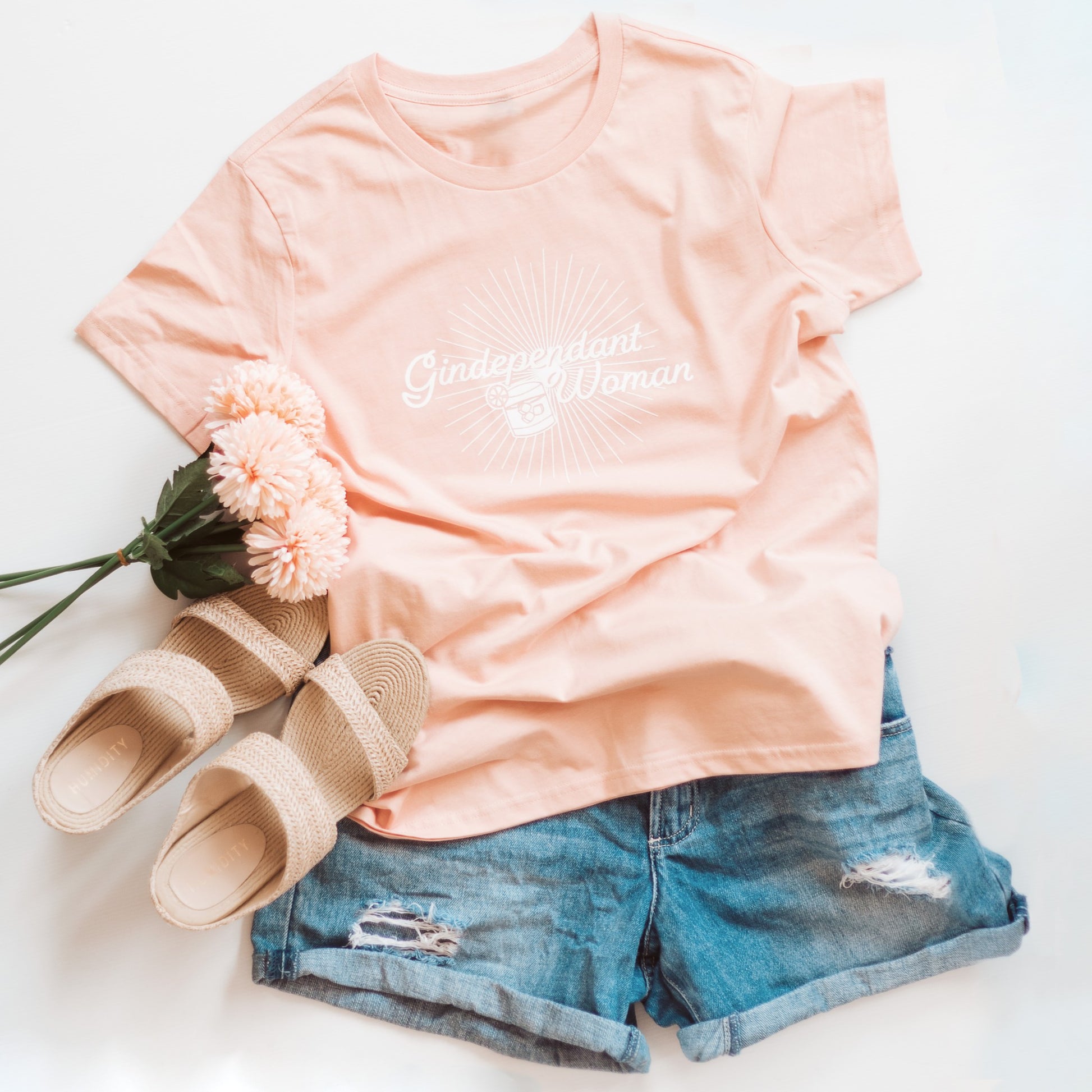 Gindependent Woman tee paired with rattan sandals and jean shorts flat lay; Pale Pink Cotton tee; Australian boho shop, summer outfit