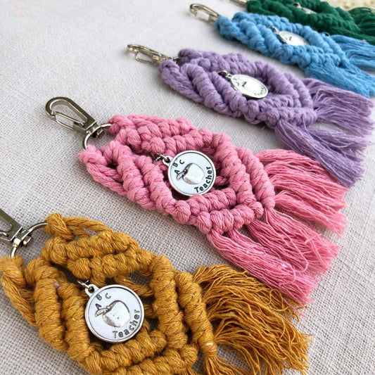 boho macrame keychains in mustard, pink, purple, blue, and green